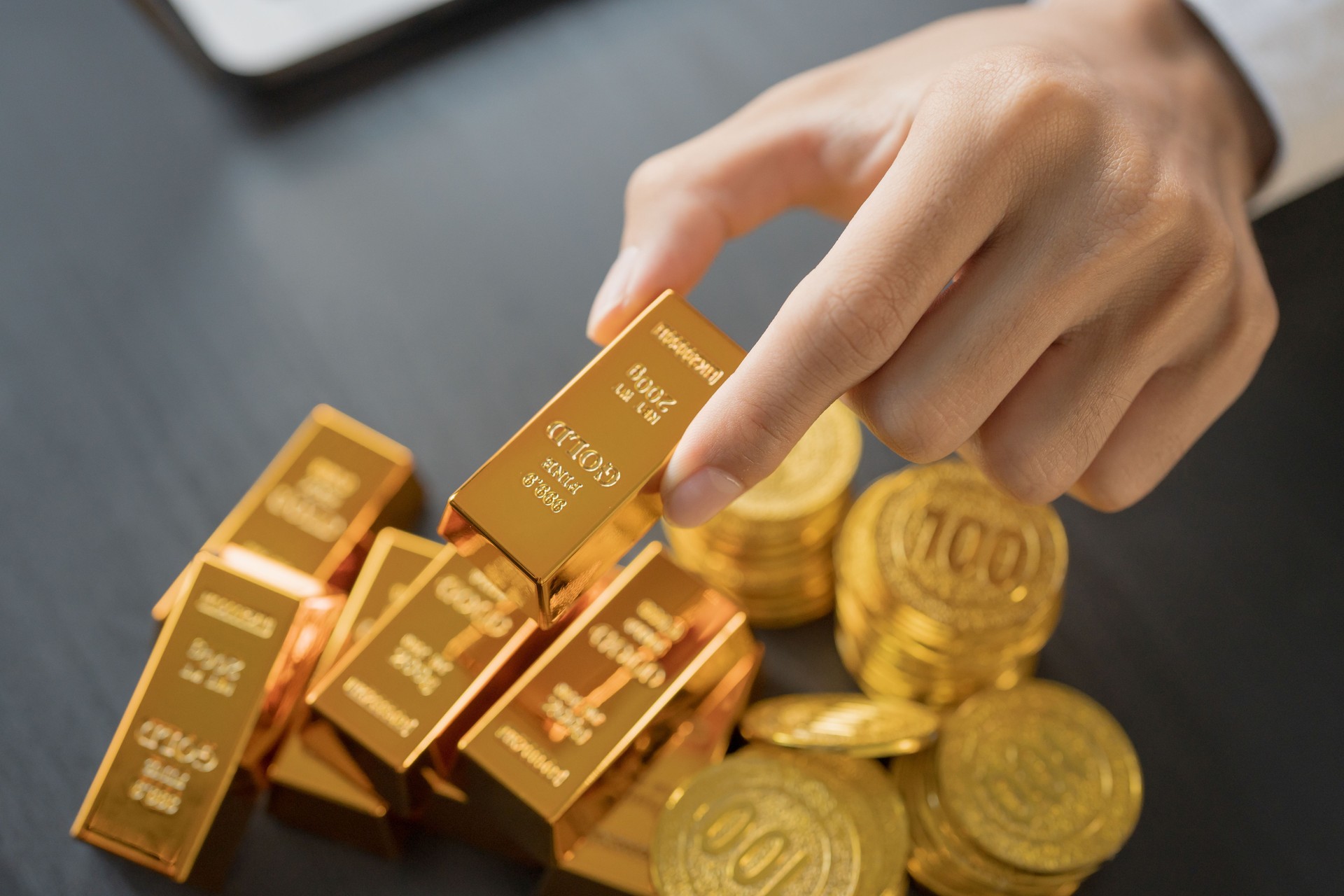 Gold Trading business man hand offering goldÂ Investment in gold mining company or Trading gold on the stock exchangeÂ Rising gold prices.